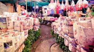 Who sells flowers in the market. Pak Khlong Talat Market At The Mouth Of The Canal Is A Market In Bangkok Thailand