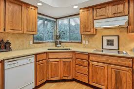 Mix a 50/50 solution of vinegar and warm water and pour it into a spray bottle. Ultimate Guide To Cleaning Kitchen Cabinets Cupboards Foodal