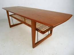 Of denmark| free delivery in nyc and hudson areas. Mid Century Danish Teak Cane Shelf Coffee Table In The Style Of Peter Hvidt 1stdibs Com Danish Modern Coffee Table Coffee Table Table