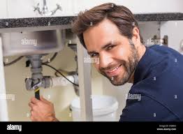 Pipe work under sink hi-res stock photography and images