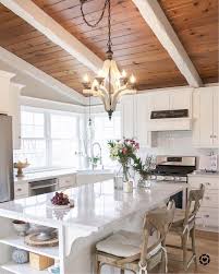 Ceiling beams in wood for the white living room small apartment exposed wood beams and white painted ceilings mid century modern White Kitchen With Natural Wood Ceiling And Painted Beams Kitchen Decor Kitchen Remodel Kitchen Design