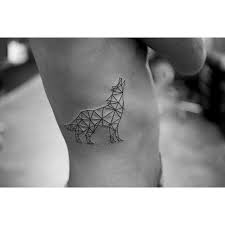 This tattoo includes a black outline wolf with different geometric lines and a dimensional shape. Geometric Wolf Tattoo On The Rib Cage Tattoogrid Net
