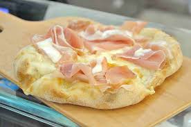 Crostini (meaning little crusts in italian; Pinsa Crostino Al Prosciutto Le Cattive Compagnie