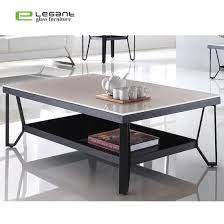 A wrought iron coffee table most often has a base fashioned from the metal with a glass tabletop. Rectangle Painting Glass Coffee Table With Black Coated Iron Base China Painting Glass Console Table Painting Glass Coffee Table Made In China Com
