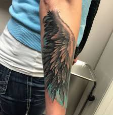 Realistic fallen angel tattoo on man right shoulder. Angel Wing Tattoos 125 Angel Wing Tattoos That Are Heavenly