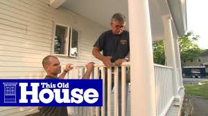 Wood railing designs for decks can use a continuous 2×6 to cap the posts. How To Build A Porch Rail This Old House Youtube