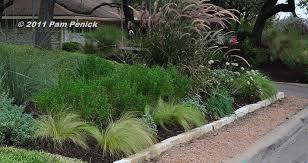 Ornamental grasses are grasses grown as ornamental plants. Streetside Bed Reduces Lawn Welcomes Visitors Digging