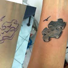 Blue and black puzzle tattoo on forearm. 3d Puzzle Piece Tattoo Pieces Tattoo Puzzle Piece Tattoo Puzzle Tattoos