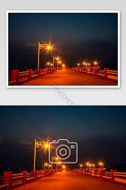 Maybe you would like to learn more about one of these? Detail Gambar Lampu Lampu Di Jembatan Pada Malam Hari Latar Belakang Laut