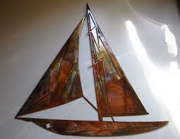 Play with different shades of blue in your bedroom design. Sailboat Metal Wall Art