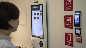 A machine that dispenses physical currency and performs the role of a bank teller. Why Your Face Could Be Set To Replace Your Bank Card Bbc News