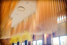 Amber Looks Gorgeous In The Morning Hong Kong Light The Focal Point Of The Dining Room Is Unique Chan Unique Chandeliers French Restaurants Restaurant Bar