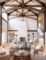 You won't be able to walk in the room without noticing the beautiful wood beams above and not marvel at their beauty. Possum Kingdom Tracy Hardenburg Designs Farm House Living Room Contemporary Living Room Design Contemporary House