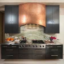 Black And Copper Kitchen Cabinets Contemporary Kitchen Boasts Stunning Copper Range Hood Kitchen Hood Design Contemporary Kitchen Kitchen Range Hood
