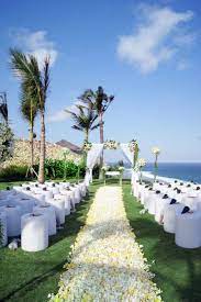 Instead Of Using Tiffany Chairs They Use White Ottoman Stools For Their Beach Wedding In Bali Bali Beaches Destination Wedding Decor Beautiful Outdoor Wedding
