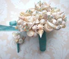 She breaks down what flowers to use, how to organize them into a gorgeous bouquet, and how to wrap the stems in a fashionable way. 20 Beach Wedding Bouquet Ideas Seashells And Flowers