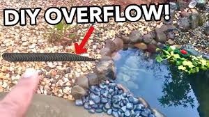The 60 foot wide spillway is designed to allow excess water to flow around the dam. Easy Diy Pond Overflow Youtube
