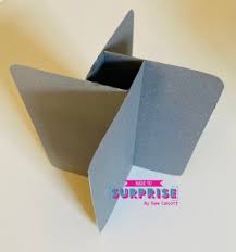 For this step, you will need your 4 x 4 cardboard piece, your three 1/2 x 4 cardboard pieces, your two 1/2 x 1 cardboard piece, and your hot glue gun with glue. Unusual Pinwheel Cards Mixed Up Craft