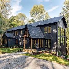 Wall sconces and industrial pendants add to the farmhouse aesthetic. 9 Most Popular Modern Farmhouse Exterior Design Ideas