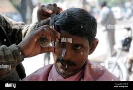 Street side barber hi-res stock photography and images