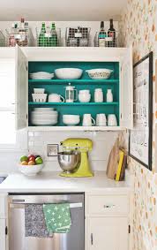A large stained open storage kitchen island with drawers and a hanging metal holder over it for an open storage unit with open shelves and a chalkboard with hooks attached, which are ideal for. 22 Kitchen Organization Ideas Kitchen Organizing Tips And Tricks