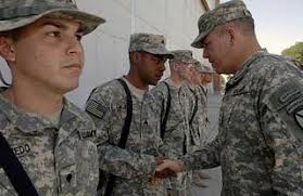 U.S. Army MAJ. GEN. Benjamin Freakley (right), Commander, Combined Joint  Task Force 76 (CJTF-76), congratulates