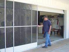 Replacing a sliding glass door costs $2,147 on average, with a typical range of $1,076 and $3,217.this includes $10 to $50 per square foot for materials and $250 to $1,650 for installation. Sliding Garage Door Screen Panels Garage Screen Door Garage Door Design Screen Door Hardware