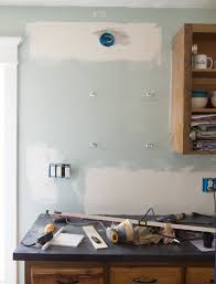 This is no problem when installing a backsplash over a countertop, but when you tile behind appliances, such as your range, there's no counter for support. Diy Marble Subway Tile Backsplash Tips Tricks And What Not To Do The Craft Patch
