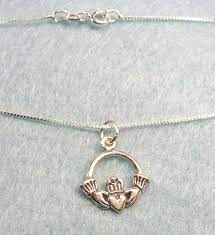 The Claddagh Charm Features A Raised Design Of Two Hands Holding A Crowned Heart The Heart Represents Love The Hands Represe Irish Necklace Claddagh Necklace