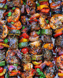 Throwing Down A White Hot Grate Full Of Sweet Spicy And Smoky Surf And Turf Skewers Gargantuan Pacific Prawns All A Cooking Recipes Fire Food Sweet And Spicy
