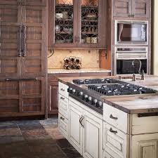 Distressed and antiqued kitchen cabinets. Painted Wood Distressed Kitchen Distressed Kitchen Cabinets Rustic Kitchen Cabinets