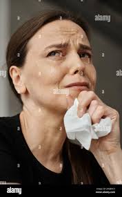 Wipes tears hi-res stock photography and images