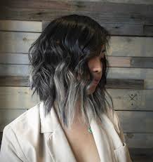 A black to red ombre hairstyle has a tint of purple to it for a feminine, soft look. The Best Antique Chic Black To Grey Ombre Hairstyles