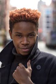 Without having to go to a hairdressers? A Young Black Man With Red Hair By Bowery Image Group Inc Stocksy United