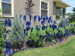 Cobalt Bottle Garden Traditional Bottle Tree At The Far End With Over 400 Bottles Glass Pieces In Her Garde Wine Bottle Garden Bottle Garden Glass Bottle Diy