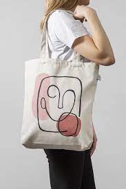 He had bags under his eyes from lack of sleep. Abstract Face Tote Bag