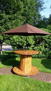 Market umbrellas, or patio table umbrellas, have a pole in the middle and will fit through the hole in an outdoor dining table. Cable Reel Table 5 Steps With Pictures Instructables