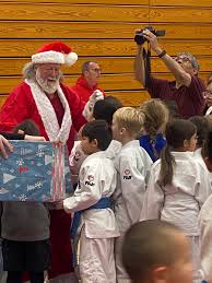 Judo Santa came and gave out presents to the younger kids.