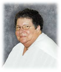 God saw she was getting tired And a cure was not to be, So He put His arms  around her And whispered "Come with me." Wi