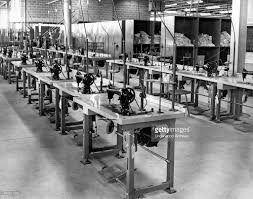 Rows Of Sewing Machines In A Garment Factory Circa 1930 Factory Interior Sewing Factory Sewing Machine
