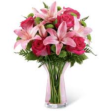 Beautiful white calla lily reflected in water. Vestal Pink Lily Bouquet At Send Flowers
