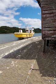 Voyagez entre santiago de chile et san juan au meilleur prix. Boat On Beach Of San Juan Isla Chiloe Chile Celebrate Big