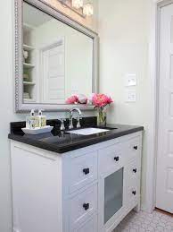 The black vanity can easily fit into any style that you already have going in the bathroom. 30 Bathroom Update Ideas In 2021 Bathroom Update Countertops Black Granite Countertops