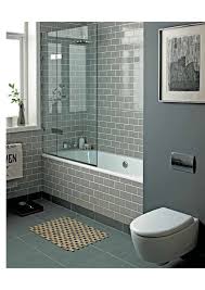 Smoke Grey Glass Subway Tiles Add A Spa Like Feel To This Tub Shower Combo Bath Bathrooms Remodel Small Bathroom Bathroom Design