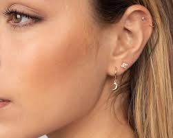 Small gold hoop earrings with charm