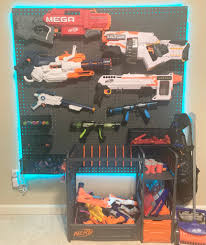 Pegboard storage for nerf gun obsession. Nerf Gun Wall