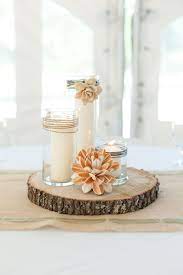This involves cutting larger boards of wood into smaller pieces called segments. A Rustic Nature Inspired Wedding Every Last Detail Wood Slab Centerpiece Wedding Centerpieces Nature Inspired Wedding
