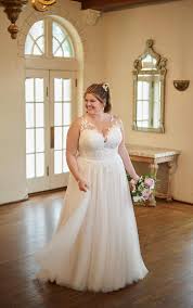 Plus size wedding dresses can be difficult to find, but have no fear! Plus Size Boho Wedding Dress With Floral Lace Neckline Stella York