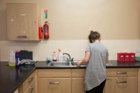 cleaning in communal kitchen, a refuge