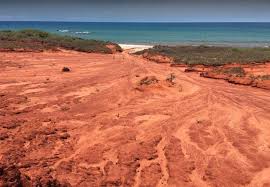 A woman relaxing at camp at the remote james price point on the dampier peninsula. James Price Point Camping Area Caravan And Camping